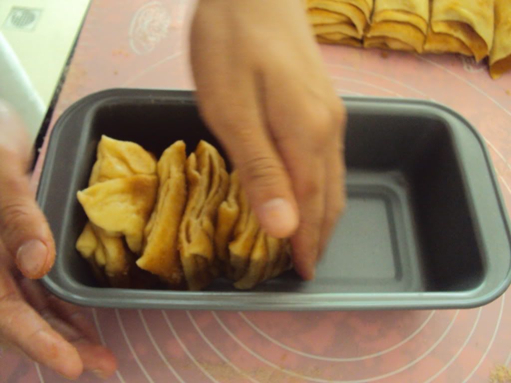 Stacking them into the pan